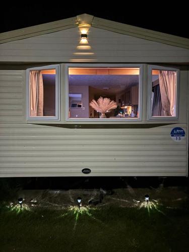 a house with a window with lights in it at 15 Maple Rise in Gristhorpe