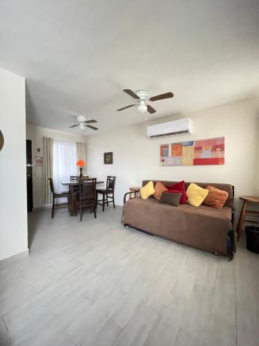 a living room with a couch and a table at Oasis in Montemorelos