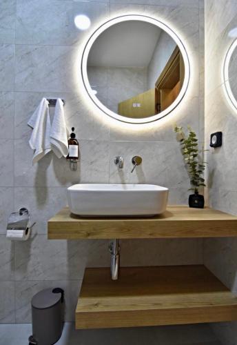 a bathroom with a sink and a mirror at Oblivion 1 in Velingrad