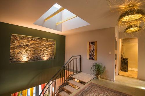 a staircase in a house with a painting on the wall at Magnifique domaine avec piscine in Montréal