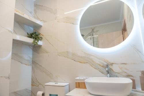 a bathroom with a sink and a mirror at Antaia 2 in Nafplio