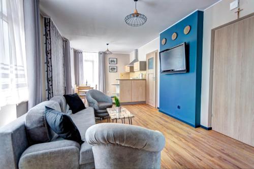 Kuchyňa alebo kuchynka v ubytovaní Apartamenty Parkowa