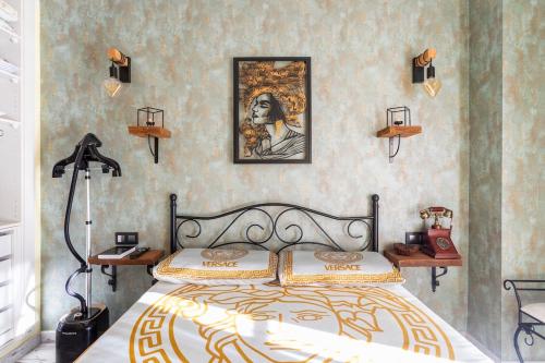 a bedroom with a bed with two lamps on the wall at Premium Oceanside Apartment, Pool, Parking in Port Saplaya