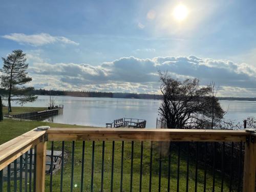 a view of a lake from the deck of a house at Riverfront Studios Inn in Sault Ste. Marie