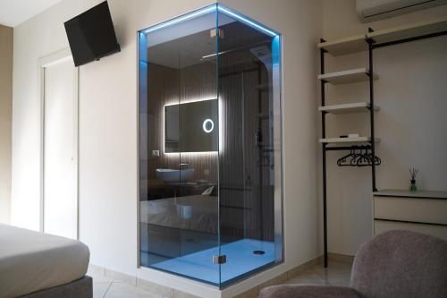 a glass shower in a bathroom with a sink at Silia's Place rooms & breakfast in Ripi
