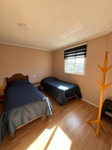 a bedroom with a bed and a window at Hostal JVDepartamento B in Nogales