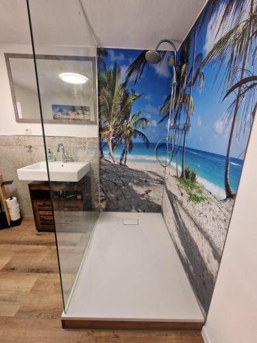 a bathroom with a view of the beach at Fewo's kleine Auszeit in Quedlinburg