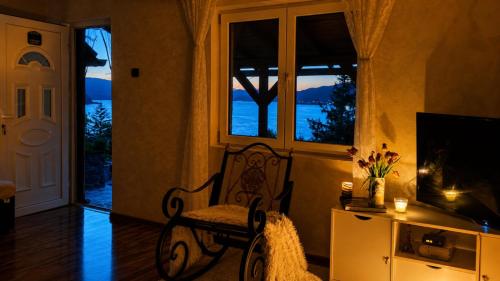 a living room with a bench and a window at Smart Nature in Donji Milanovac