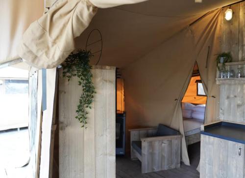 a room with a tent with a bed in it at F1 Group Stay Close to Track Parking Grumpy in Amblève