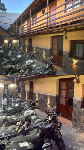 a group of motorcycles parked in front of a building at Hotel Refugio Del Sol in La Quiaca