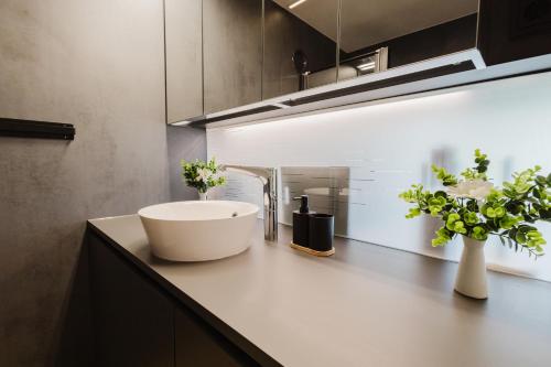 a bathroom with a sink on a counter at Premium Studio mit Balkon - Pfarrkirchen in Pfarrkirchen