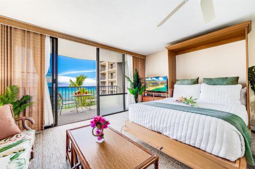 a bedroom with a bed and a view of the ocean at Oceanfront Kahana Condo Ocean View, Beachfront, Pool & Sleeps 4, Walkable Area in Lahaina