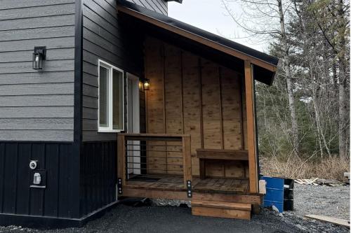 a cabin with a large door on the side of a house at Seward Mountain View Cabins #7 in Seward