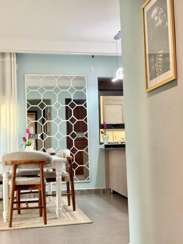 a kitchen with a table and chairs in a room at comfort homes in Kampala
