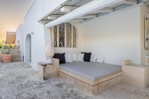 a bedroom with a large bed in a room at Serena Armando Exclusive Villas with Private Pools in Rosa Marina