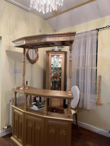 a dressing table with a mirror on top of it at Lynebank House Hotel, Bed & Breakfast in Carlisle