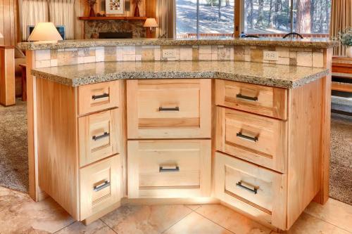 a kitchen with a large island with wooden cabinets at 10B Arrow Lodge in North Wawona