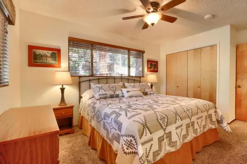 a bedroom with a bed and a ceiling fan at 10B Arrow Lodge in North Wawona