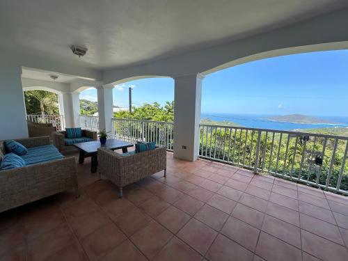 a living room with a view of the ocean at Villa Zeddy in Nazareth