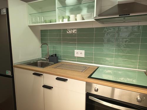 a kitchen with a sink and a counter top at House with a private pool, relaxation guaranteed in Talavera de la Reina
