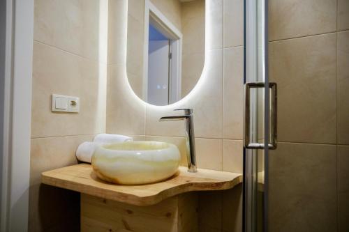 a bathroom with a sink and a mirror at Step by Step Atlantic Guesthouse in Vila do Conde