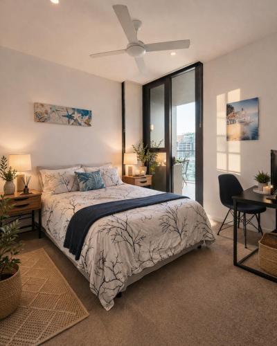 a bedroom with a bed and a desk and a window at Bedroom with Private Bathroom in cozy shared appartment! in Brisbane