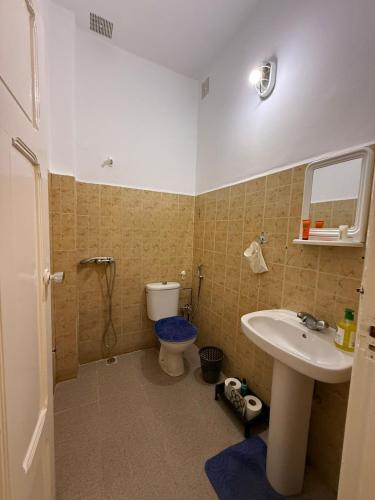 a bathroom with a sink and a toilet at Maison front de mer in El Jadida