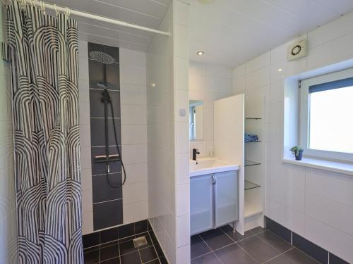 a bathroom with a shower and a sink at Scheldeoord 54 in Baarland