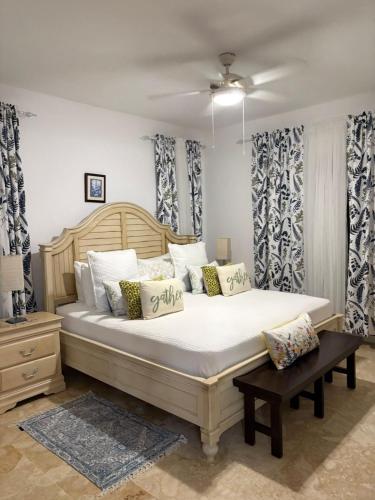 a bedroom with a large bed with pillows at Las Marías in El Morón