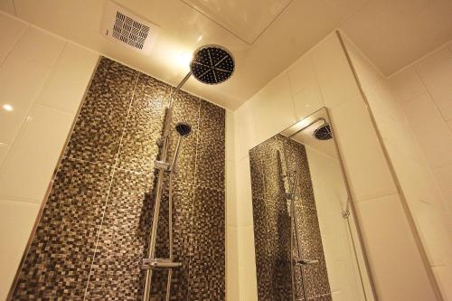 a bathroom with a shower in a room at Incheon Soma Hotel in Incheon