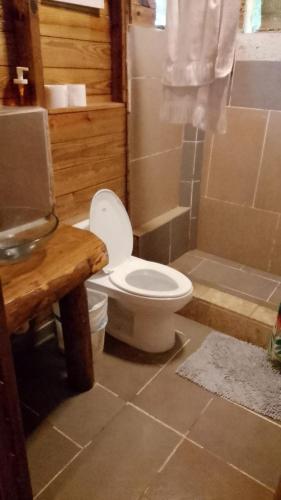 a bathroom with a toilet and a shower at Mar Villa Eco Lodge Surf & Kite Perla Marina by Encuentro Beach in Sosúa