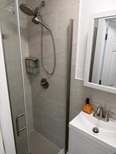 a bathroom with a shower and a sink at The Revival Guest House near Times Square in New York