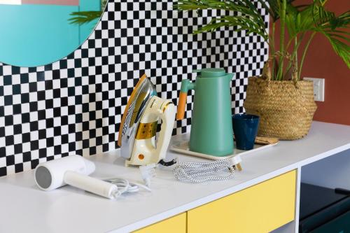 a kitchen counter with a mixer on top of it at Parkland Hotel in Brinchang