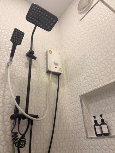 a bathroom with a hair dryer and a mirror at SB The Moon Night Betong in Betong