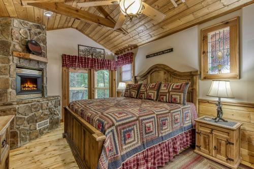 a bedroom with a bed and a fireplace at Mountain Dreams in Sevierville