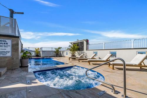 a hot tub on the roof of a building at McLeod Rise - Cairn Base with Rooftop Pool & Spa in Cairns