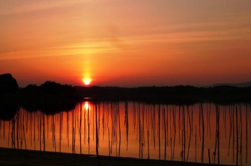 a sunset over a body of water at Miyako Resort Okushima Aqua Forest in Shima