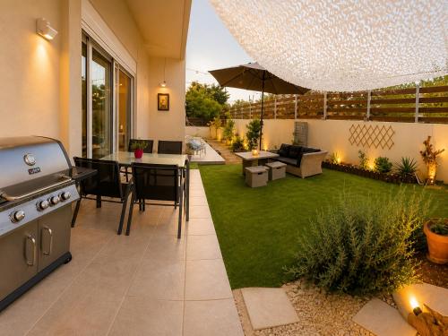 Foto S&M Cozy Garden Lagonissi 5
