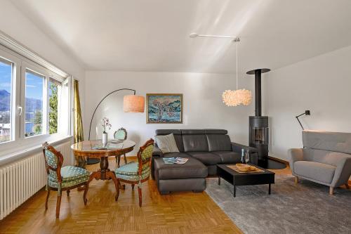 a living room with a couch and a table at Ca' Lidia - Lugano Villa with Garden and Parking - Happy Rentals in Pregassona