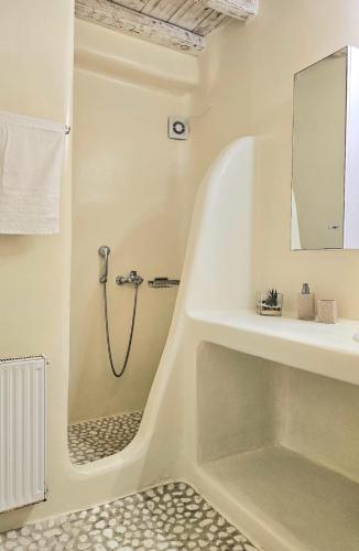 a bathroom with a shower and a sink at Villa Magenta in Mikonos