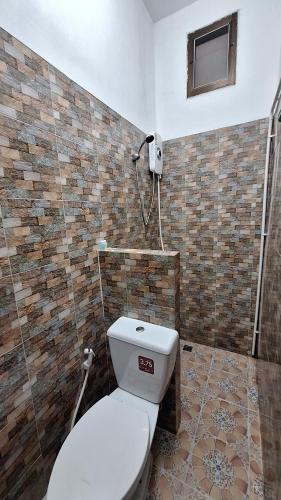 a bathroom with a toilet and a shower at Runa Runa The Best Samed Island in Ko Samed