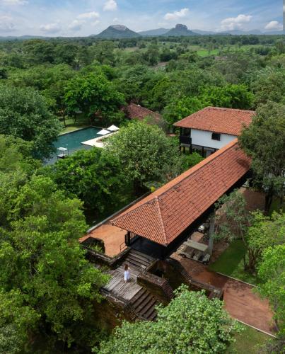 an overhead view of a house with a roof at Sigiriya Jungles Resort & Spa in Sigiriya