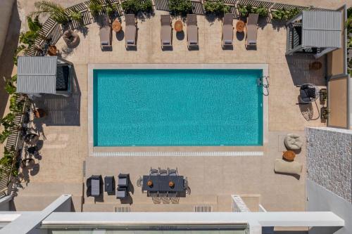 an overhead view of a swimming pool in a building at Arfna Grand Villa in Afantou