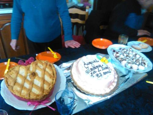 a table with a cake and a pie on it at L'Oasi in Auletta