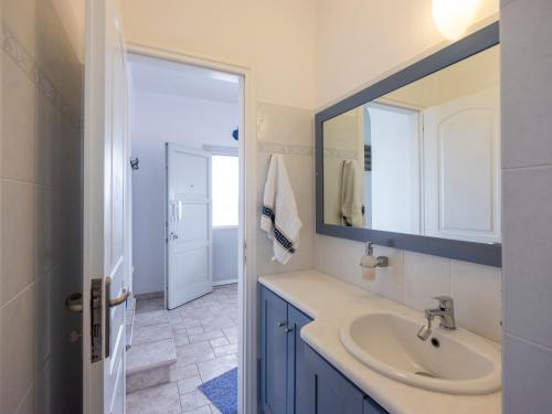 a bathroom with a sink and a mirror at Angel Serenity Villa in Kampos Paros