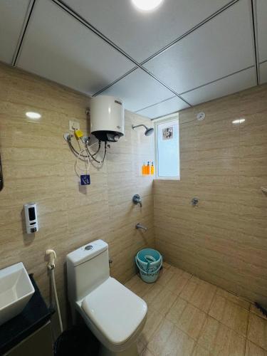 a bathroom with a toilet and a sink at Candlewick Homestays in Jaipur