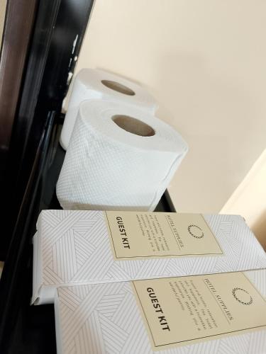 a roll of toilet paper sitting on top of boxes at Gia's Baguio Transient House in Baguio