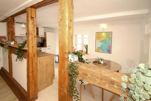 a kitchen and dining room with a glass table at THEFIVE60 Apartments in Braunlage
