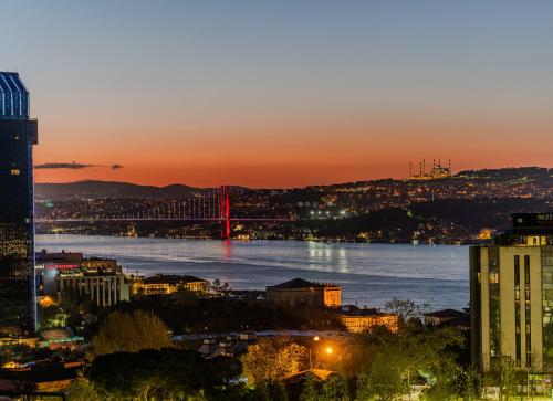 a view of a bridge over a river at sunset at Midtown Hotel in Istanbul
