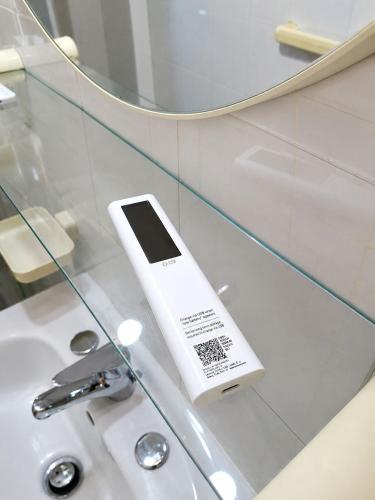 a cell phone sitting on top of a bathroom sink at Sila Magico Incanto in Camigliatello Silano